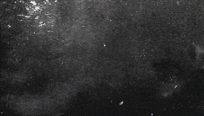 Fototapeta premium vintage black and white grainy texture resembling outer space, stars, or cosmic dust for abstract backgrounds, overlays, or designs
