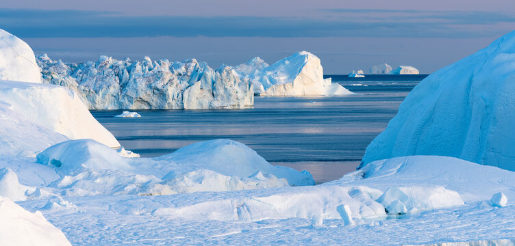Icebergs Melting In The Ilulissat Icefjord, Western Greenland  