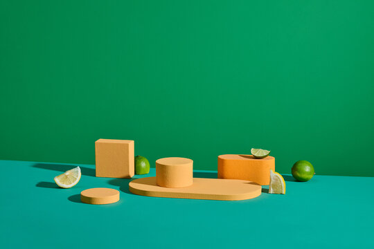 Colorful Geometric Shapes With Citrus Fruits on Green Background