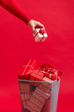 Christmas presents and gifts in trash can. Over consumption 