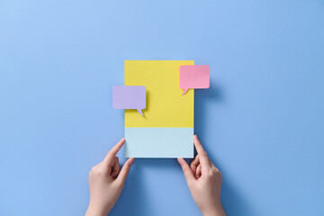 Hands are showcasing social media notifications with message bubbles 