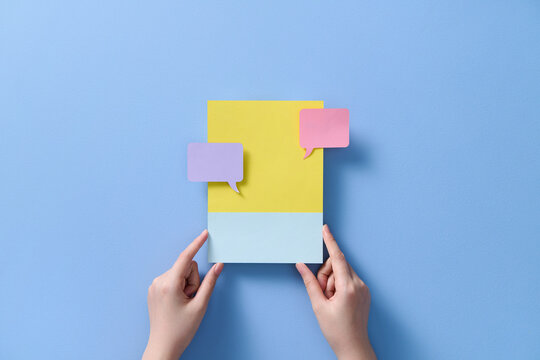 Hands are showcasing social media notifications with message bubbles 