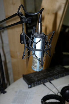 A professional microphone on a stand
