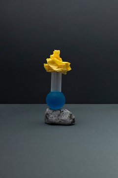 A creative arrangement made of different objects on a stone base