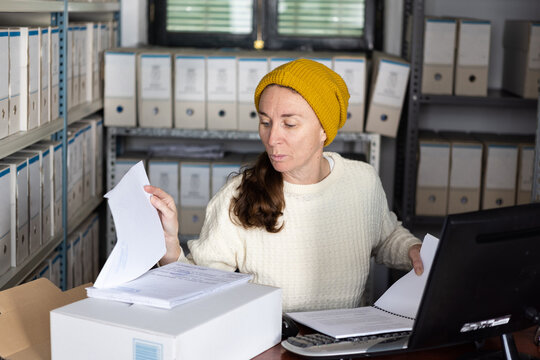 An archivist checking business documents