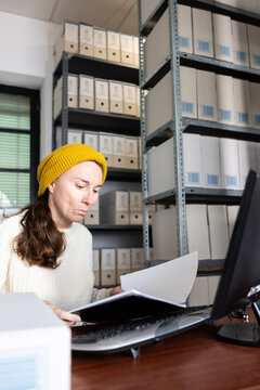 An archivist checking business documents