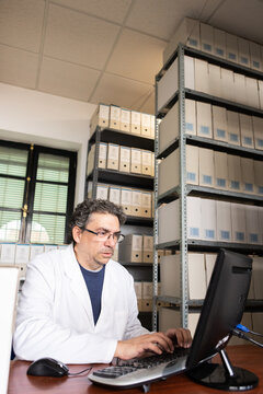 Archivist checking records.