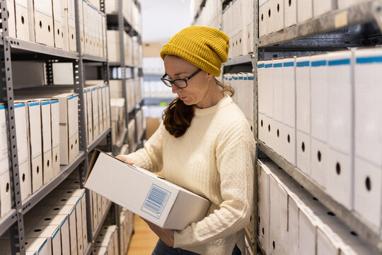 Archivist checking records