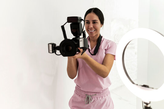 Dentist using digital camera for dental records