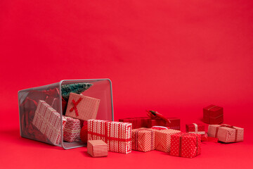 Christmas presents / gifts falling out of trash can. Over consumption 