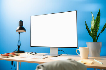 A computer with white screen on the table