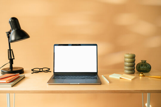 A laptop with white screen on the table