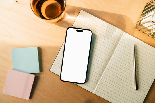 A mobile phone with white screen in the office