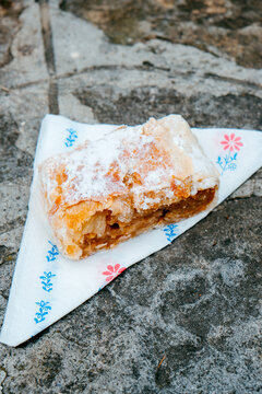 piece of almasretes, the Hungarian apple strudel, on the street
