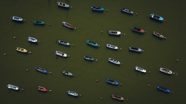 Serene River Scene with Moored Ships