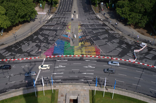 Vibrant street mural of rainbow at the iconic victory column in Berlin