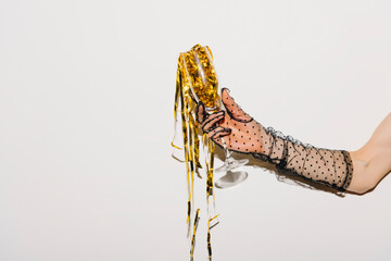 Elegant Hand in Polka Dot Glove Holding Champagne Glass