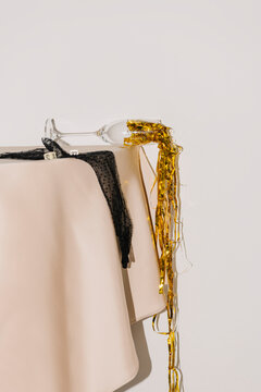 Elegant Party Remnants With Champagne Glass and Golden Streamers