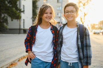 Portrait of smiling school kids standing at school yard