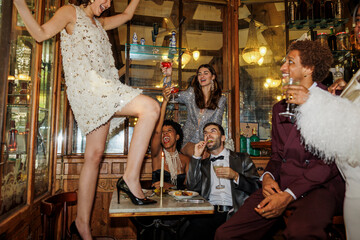 Friends celebrating new year's eve in a luxurious restaurant ugc