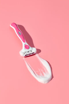 Pink Razor Shaving Foam on Vibrant Pink Background