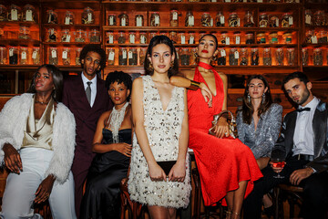Elegant friends celebrating new year's in a luxurious vintage bar ugc