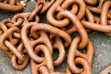 Large rusty chain in a pile