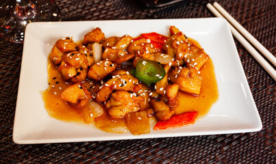 Tasty teriyaki chicken with stewed peppers and onion