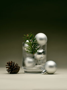 Glass container with pine and silver ornaments for winter