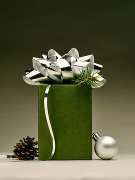 Elegant green gift box with festive silver ribbon and bow