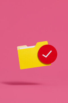 Yellow Folder With Red Check Mark on Pink Background