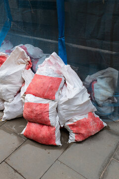 Construction on a street: building tools and materials on a floor 