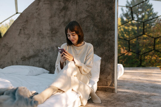 A woman uses a mobile phone