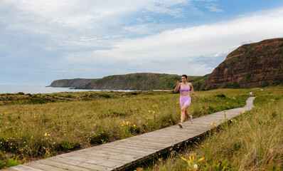 Woman Running on Scenic Path