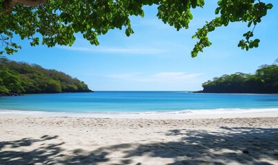 Pristine tropical beach with clear turquoise waters, white sand, and lush green foliage under a bright blue sky