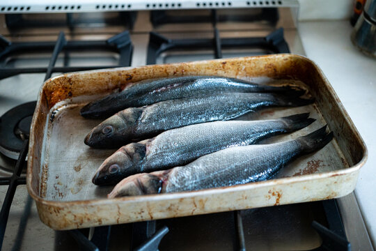 A pair of hands cutting fish