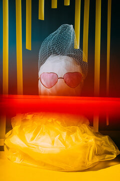 Art installation with yellow and red under neon lights.