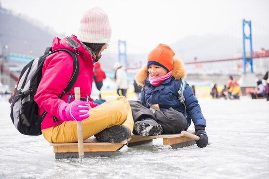 Family Bonding Traditional Korean Ice Sledding Winter Festival J
