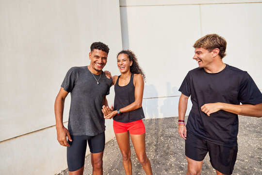 Friends sharing a lighthearted moment post-run