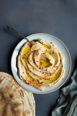 Greek Baba Ganoush, Lebanese Baba Ghanoush a Middle Eastern and Mediterranean Spread and Dip Topped with Paprika, Red Pepper Flakes and Olive Oil and served with pita bread