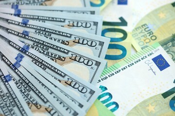 Big pile of Euro and USD banknotes. Many european and united states dollars