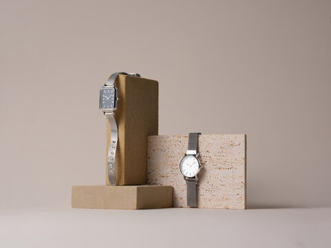 Sophisticated silver wristwatches showcased on geometric stone - Powered by Adobe