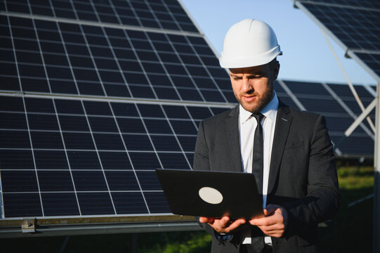 The solar farm, solar panel with engineer check the operation of the system, Alternative energy