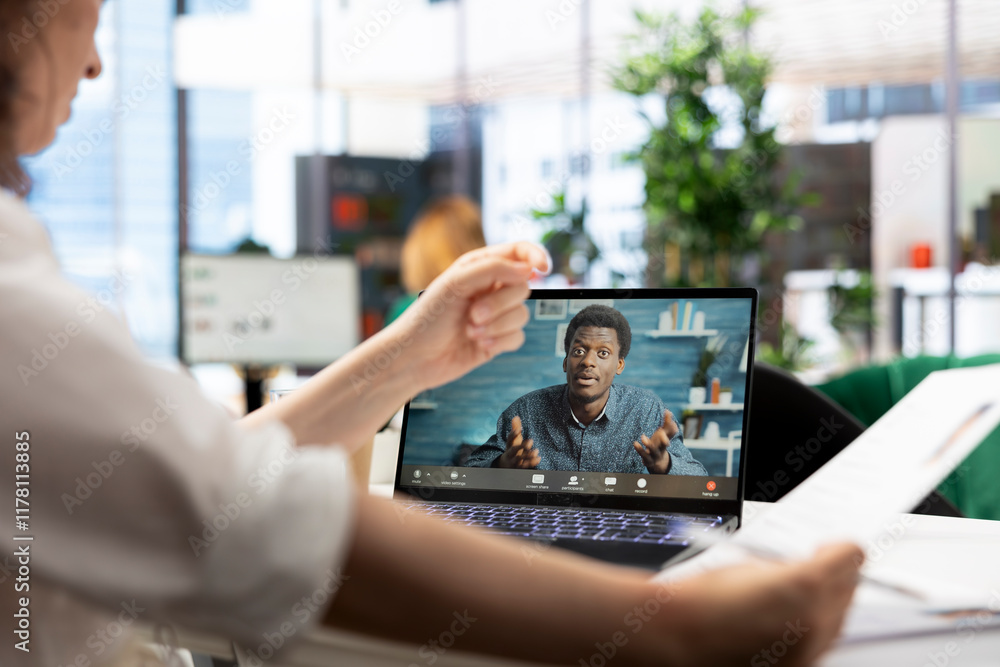 Poster human resources worker browsing through cvs while in videocall with applicant. hr employer selecting