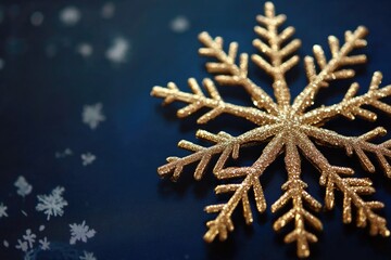 A single gold snowflake floating on a blue background