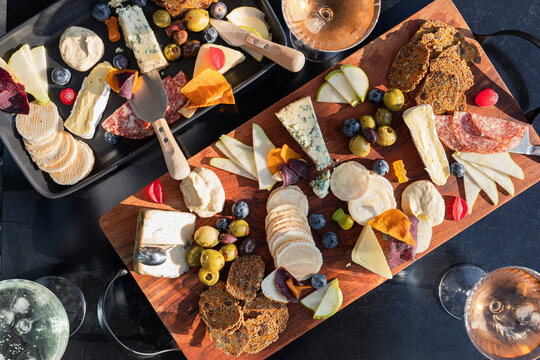 Cheese and charcuterie board with fruits and crackers