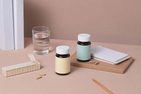 Daily Health Routine with Vitamins, Water, and Notepad