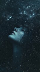 A surreal image of a person's face and flowing hair blending into a dark, starry night sky, creating a celestial scene.