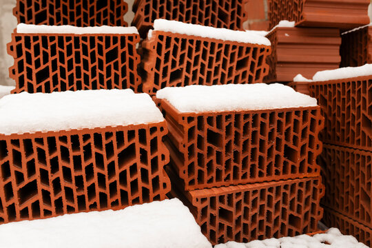 Red bricks covered in snow