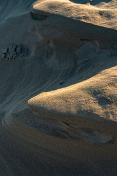 Wind blown sand dune with sharp shadow pattern